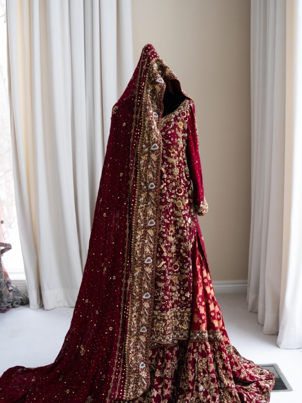 Hand-Embroidered Maroon Bridal Dress with Gold Accents